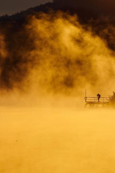 The Adda River shrouded in fog.