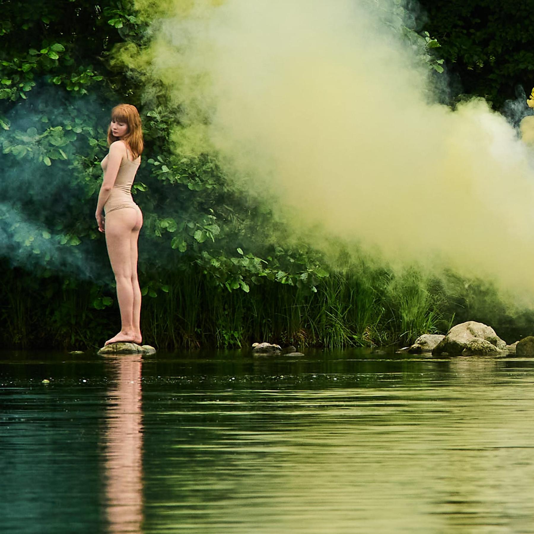 He was a curious figure. He was positioned on the opposite bank of the river.