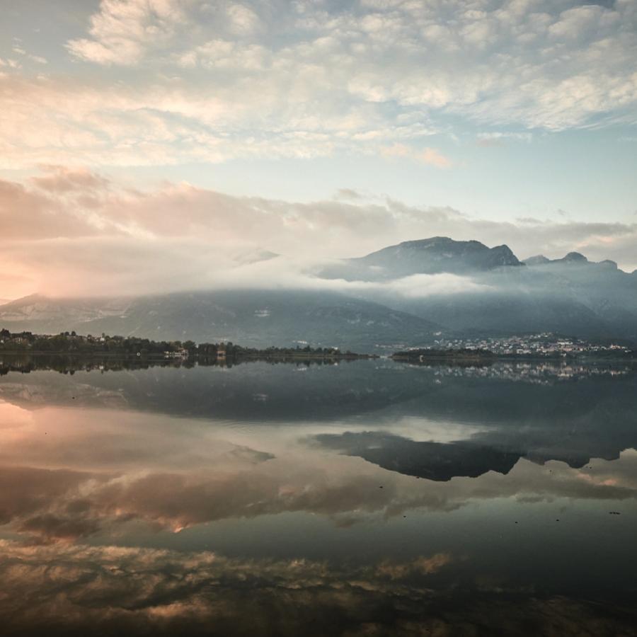 The sun sets over Lake Oggiono, Lecco.