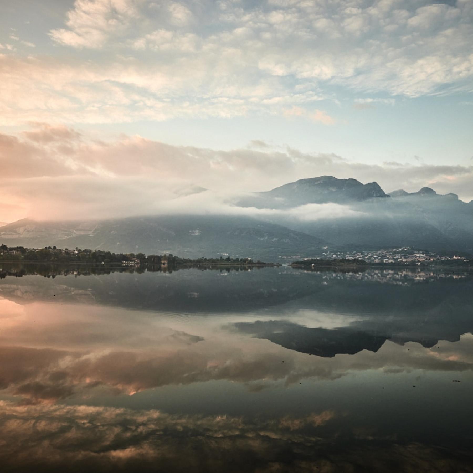 The sun sets over Lake Oggiono, Lecco.